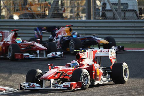 Fernando Alonso leads Felipe Massa and Sebastian Vettel