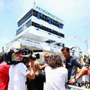 Mark Webber answers questions in the paddock