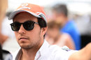 Sergio Perez listens intently during a media session