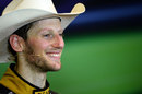 Romain Grosjean wears a cowboy hat in the post-race press conference