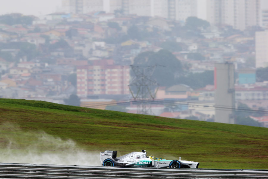 Nico Rosberg leaves a plume of spray during FP2