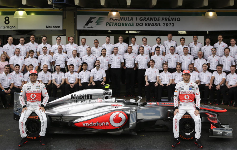 Sergio Perez and Jenson Button pose for a McLaren team photo
