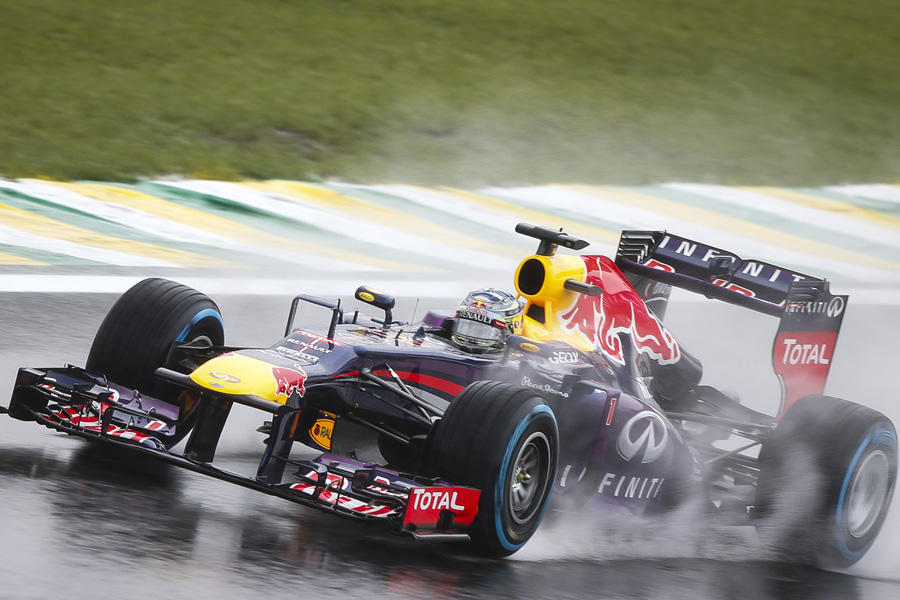 Sebastian Vettel drives through the rain during FP3