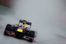 Sebastian Vettel on track in the worst of the conditions
