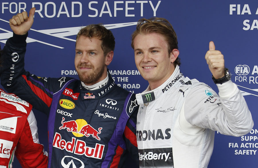 Nico Rosberg alongside Sebastian Vettel after qualifying