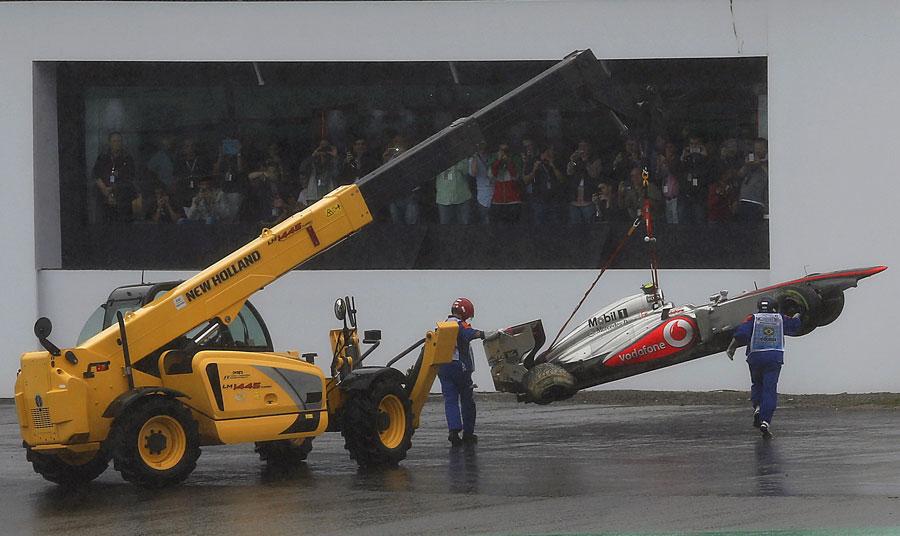 Sergio Perez's damaged McLaren is recovered