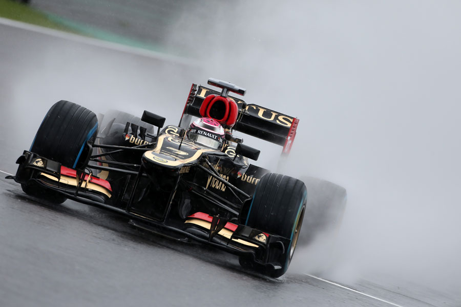 Heikki Kovalainen on track using full wets