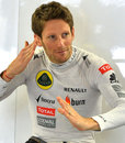 Romain Grosjean shows off his judo moves in the Lotus garage