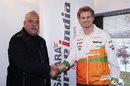 Force India boss Vijay Mallya and Nico Hulkenberg shake on a deal for a 2014 drive