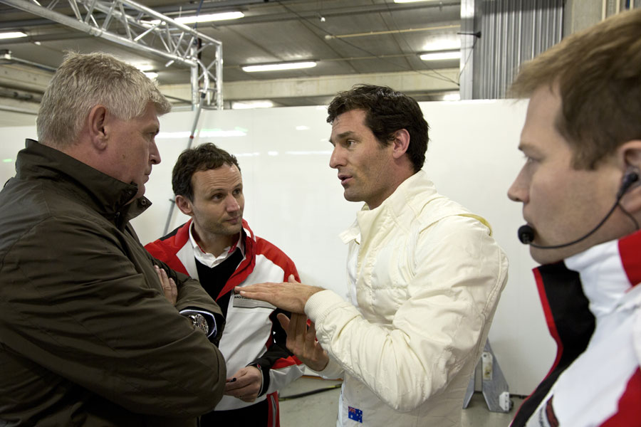 Mark Webber chats to his engineers after his first test in Porsche's LMP1 car 