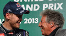 Sebastian Vettel shares a joke with Mario Andretti