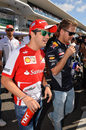 Felipe Massa chats to Sebastian Vettel ahead of the race