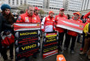 Ferrari fans gather outside the hospital in Grenoble to mark Michael Schumacher's 45th birthday