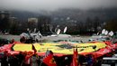 Ferrari fans unveil a giant flag during a vigil for Michael Schumacher on his 45th birthday