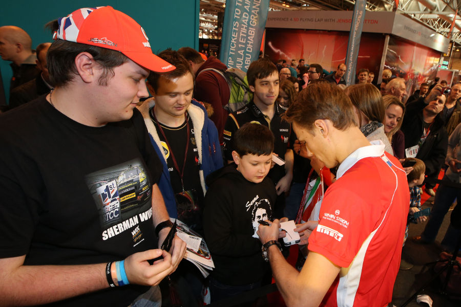 Max Chilton signs autographs for fans at the Autosport International Show