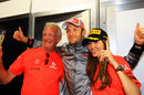Jenson Button celebrates his victory with girlfriend Jessica Michibata and father John
