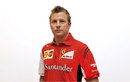 Kimi Raikkonen poses in Ferrari team clothing