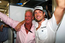 Jenson Button celebrates winning the world championship with his father John