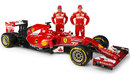 Fernando Alonso and Kimi Raikkonen stand with the new Ferrari F14 T