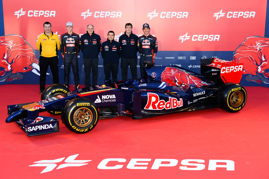 The Toro Rosso team pose for a photo with the STR9