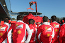 Ferrari crew watch on as the F14T is returned to the pitlane after stopping on track during the opening Jerez test
