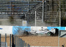 Lewis Hamilton hits the tyre barrier at Turn One