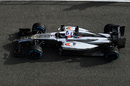 An aerial view of Jenson Button in the McLaren in the pit lane