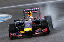 Sebastian Vettel takes the Red Bull RB10 through the wet