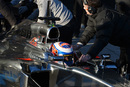 Jenson Button is pushed back into the pits on the third day of testing 