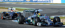 Lewis Hamilton exits a chicane with the Sauber of Adrian Sutil in close contention