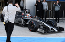 Kevin Magnussen pulls out of the pits for his first crack behind the wheel of the McLaren