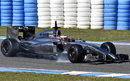 Kevin Magnussen locks up his front right on his first run out in the McLaren