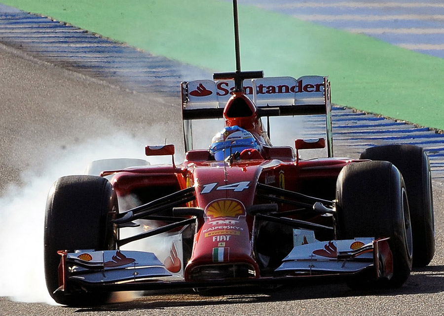 Easy Fernando... Alonso locks up in the F14 T