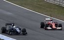 A rare sight as Fernando Alonso slows down to let Felipe Massa passed