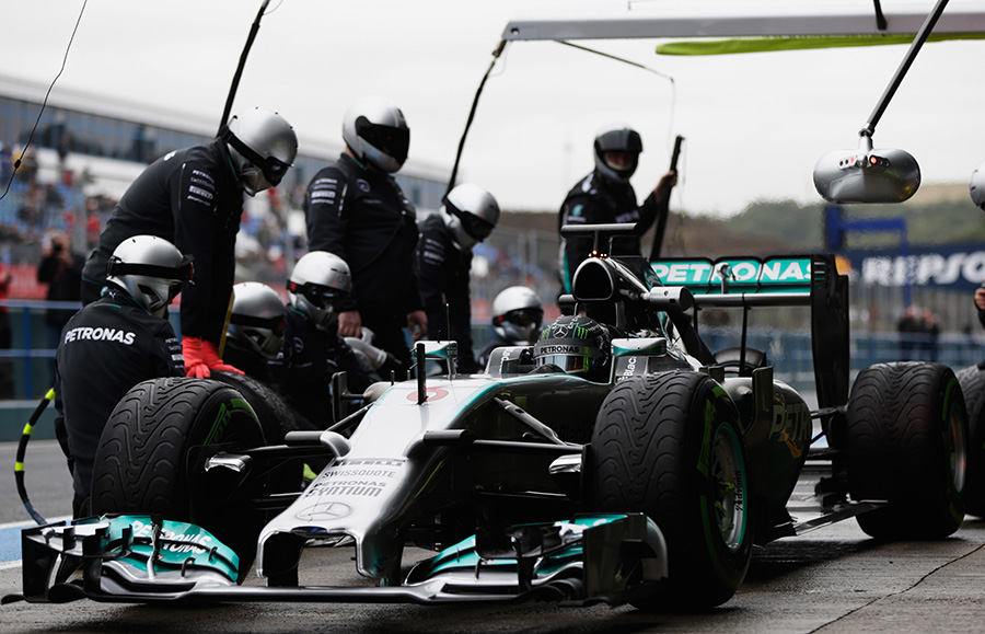 Nico Rosberg pulls away from a pit stop 