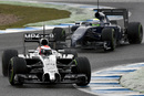 McLaren's Kevin Magnussen with Felipe Massa's Williams in close quarters