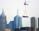 A Red Bull F1 car arrives at Albert Park by helicopter to promote this year's Australian Grand Prix