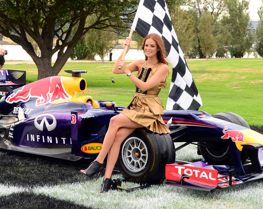 Australian model Georgia Geminder poses with a Red Bull at an event to promote the Australian Grand Prix