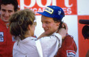 Niki Lauda is congratulated by wife Marlene after sealing his third world title