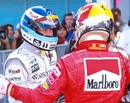 Michael Schumacher congratulates Mika Hakkinen on winning the drivers' title