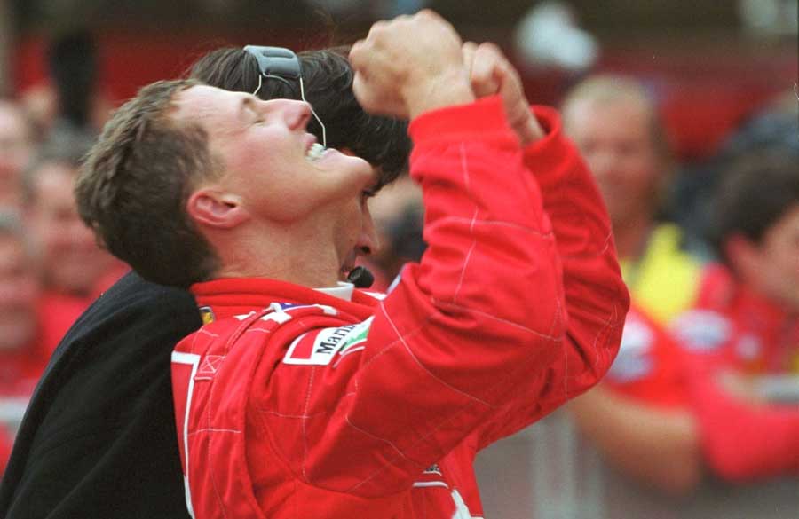 Michael Schumacher celebrates winning Ferrari's first drivers' title since 1979