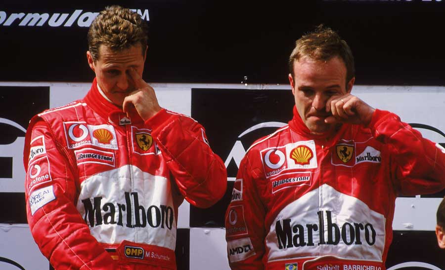 An embarrassed Michael Schumacher and Rubens Barrichello on the podium after the 2002 Austrian Grand Prix