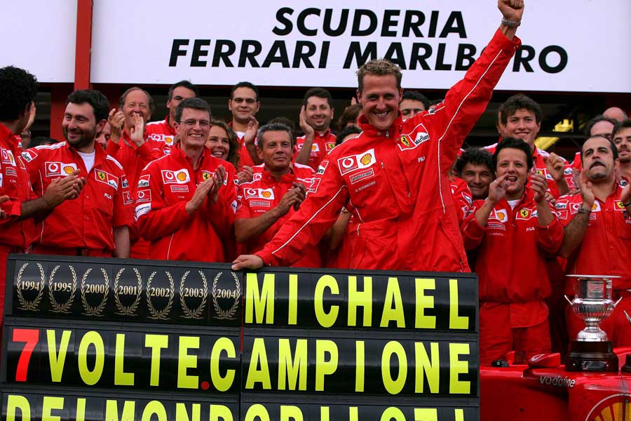 Michael Schumacher celebrates winning his seventh drivers' title at Spa
