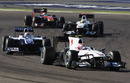 Kamui Kobayashi leads a gaggle of cars in Bahrain