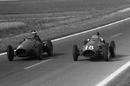Hawthorn and Fangio exchange glances during the closing laps of their epic clash in the French Grand Prix