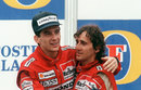 Ayrton Senna embraces his team-mate and race winner Alain Prost