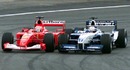 Juan Pablo Montoya pulls off an audacious overtaking move on Michael Schumacher