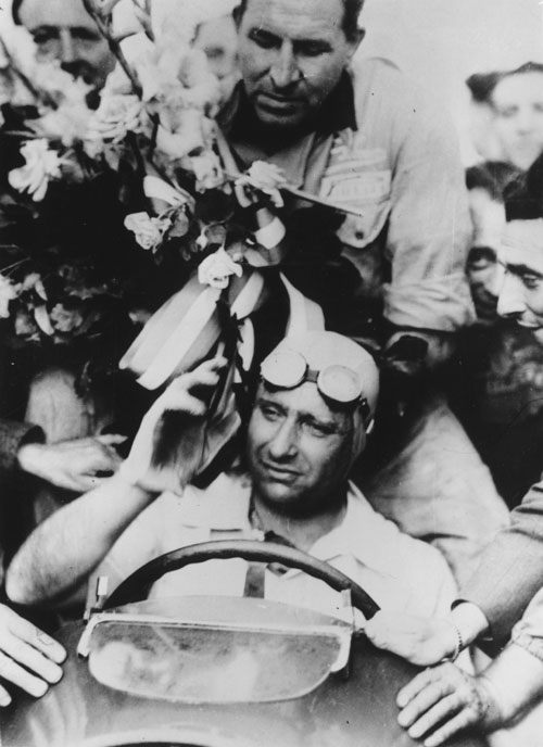 Juan Fangio takes the plaudits at the French Grand Prix at Rheims