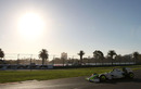 Jenson Button on his way to victory as the sun sets