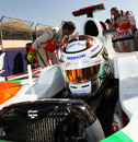Adrian Sutil makes his last-minute checks ahead of the race
